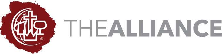 A person raising their hand in a group setting