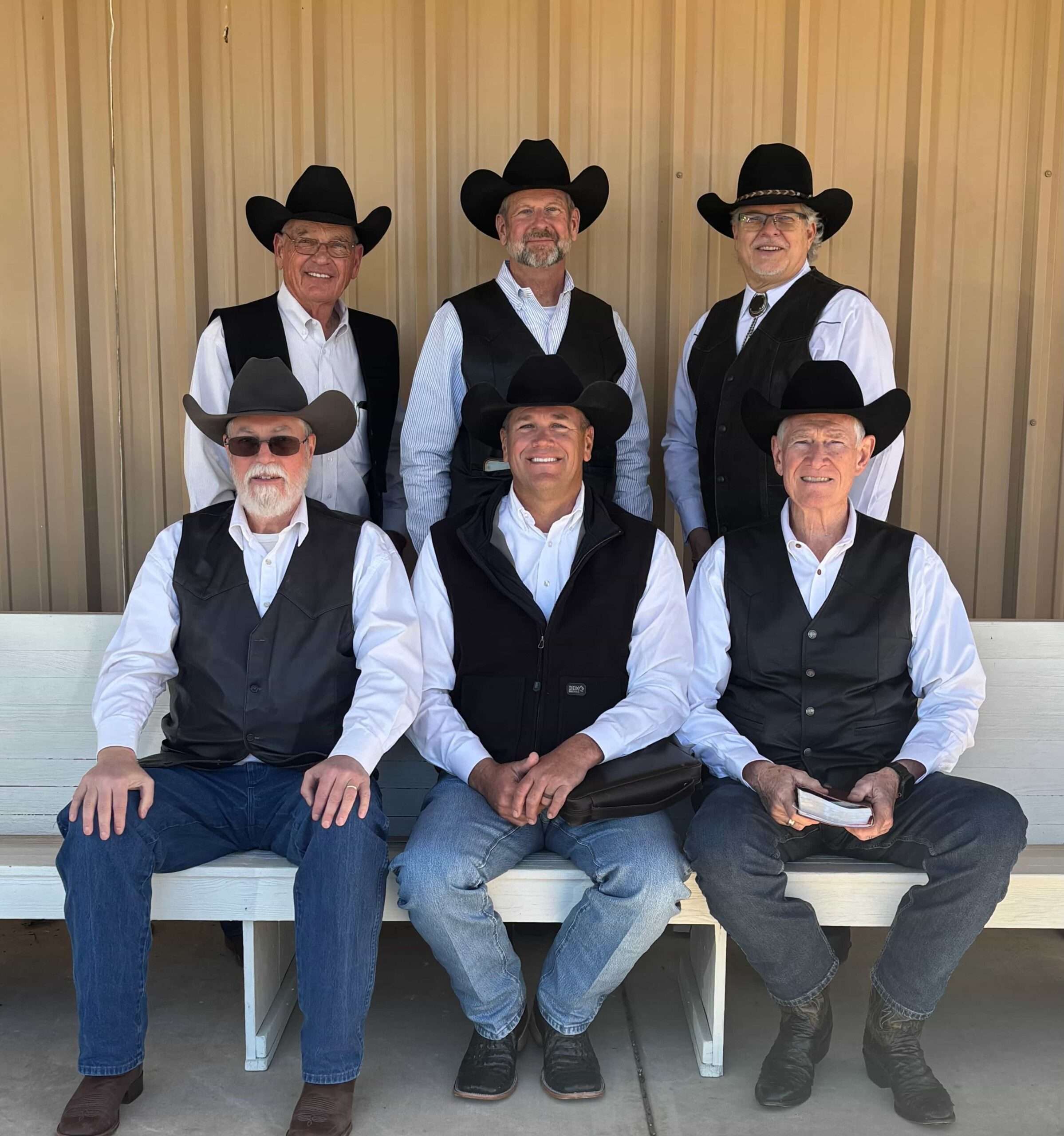 A person raising their hand in a group setting